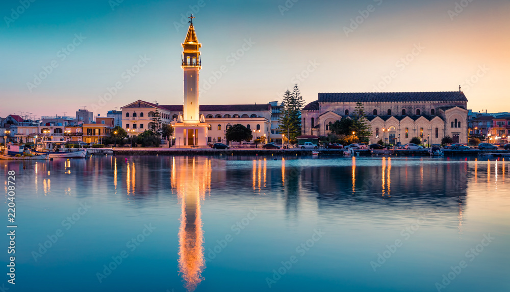 Picturesque spring sunset in the Zakynthos city. Great evening view of the town hall and Saint Dionysios Church,  Zakynthos island, Greece, Europe. Traveling concept background.