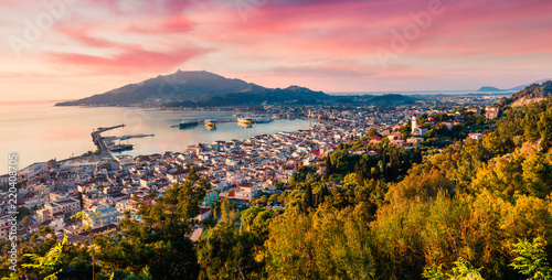 Aerial view of Zakynthos (Zante) town. Colorful spring sunrise on the Ionian Sea. Beautiful cityscape panorama of Greece city. Traveling concept background. Artistic style post processed photo.