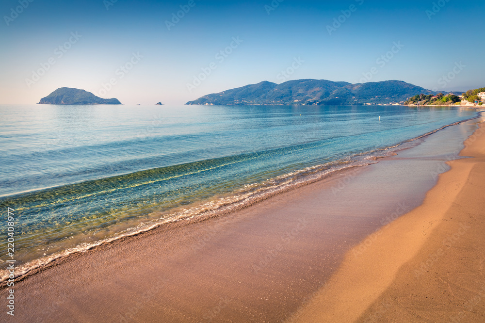 Fototapeta premium Cozy morning view of beach of Zakynthos (Zante) island. Sunny spring seascape of the Ionian Sea, Greece, Europe. Beauty of nature concept background.