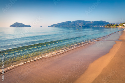 Cozy morning view of beach of Zakynthos (Zante) island. Sunny spring seascape of the Ionian Sea, Greece, Europe. Beauty of nature concept background. photo