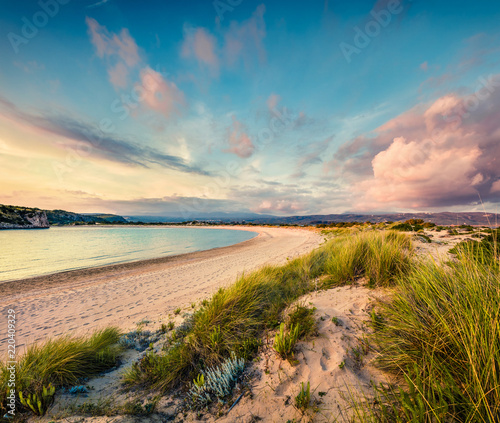 Fototapeta Naklejka Na Ścianę i Meble -  Colorful spring view of Voidokilia beach. Colorful sunset on the Ionian Sea, Pilos town location, Greece, Europe. Beauty of nature concept background. Artistic style post processed photo.