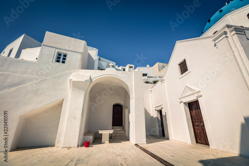 Courtyard of the St. Gerasimos Christian Church in famous Grrek resort Fira, Santorini island, Greece, Europe. photo