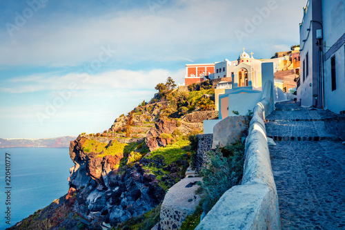 Fototapeta Naklejka Na Ścianę i Meble -  Sunny morning view of Santorini island. Picturesque spring scene of the famous Greek resort Fira, Greece, Europe. Traveling concept background. Artistic style post processed photo.