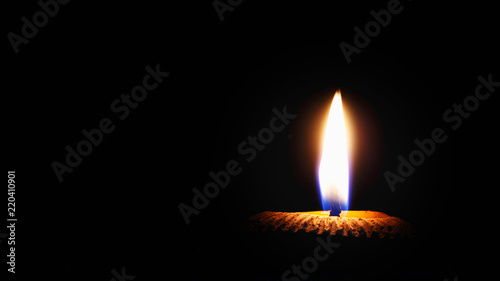 lighting candle on black background