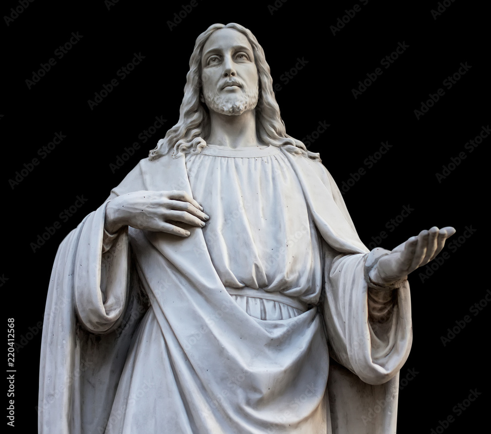 a statue of jesus with open hands. isolated