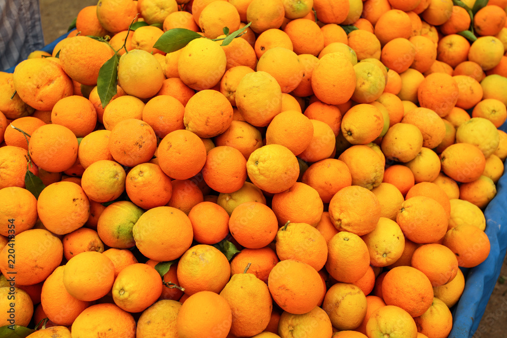 Pile of oranges displayed on food market.