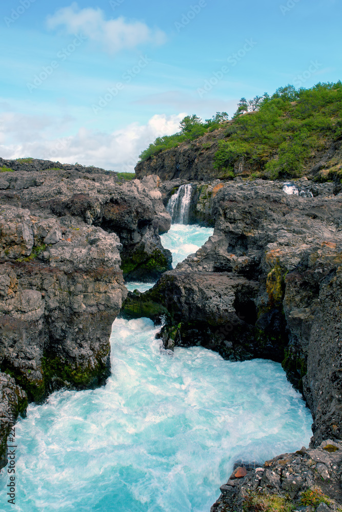 Barnafoss waterfall - Western Iceland. Water flows near Barnafoss waterfall, called also 'Waterfall of the children'