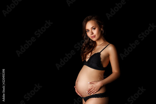 beautiful pregnant woman standing in her underwear © Екатерина Переславце