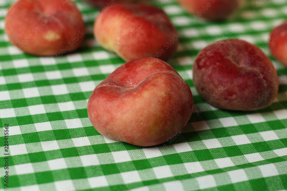 Fruit placement on white green cloth,with peaches. Fruit placement on white green cloth,with peaches.
