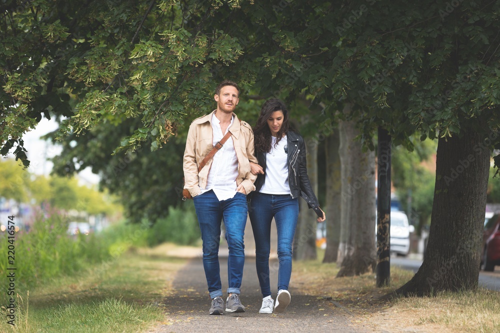 Couple walking on street in the city Couple walking on street in the city