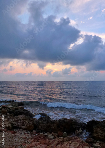 Sunset at the sea, clouds in the sun, summer vacation