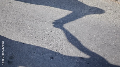 Wallpaper Mural Shadow of the couple holding hands on the floor. Silhouette of the shadow of the newlyweds on the asphalt. Torontodigital.ca