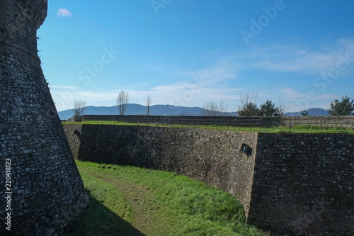 Meieval fortress walls in Sarzana city, Italy photo