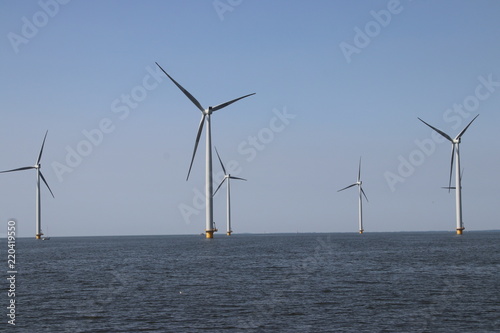 Modern wind turbines in the Noordoostpolder in the Netherlands for sustainable electricity