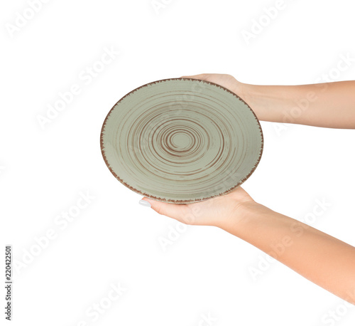 Hand holding green empty plate isolated on white background. perspective view, isolated on white background