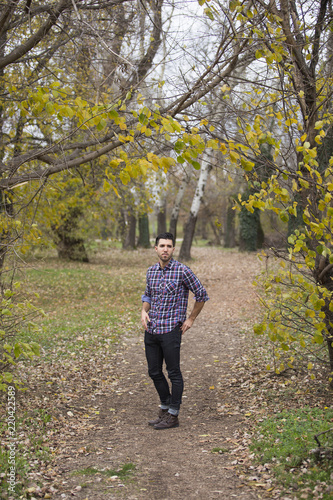 young handsome man in nature ,autumn .serious thoughts © arizanko
