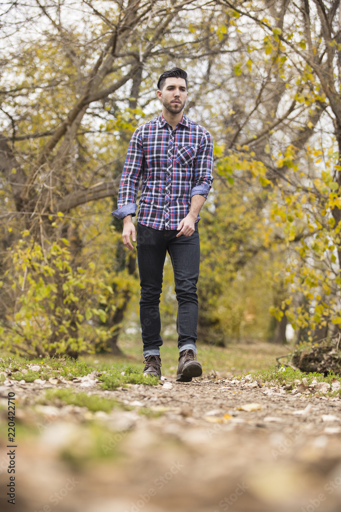 young handsome man in nature ,autumn .serious thoughts young handsome man in nature ,autumn .serious thoughts