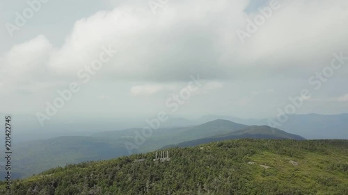 Aerial footage of White Cap Mountain situated within the watershed of the Pleasant River located in Piscataquis County, Maine. It has a distinguished treeline and remains snow covered into summer. photo