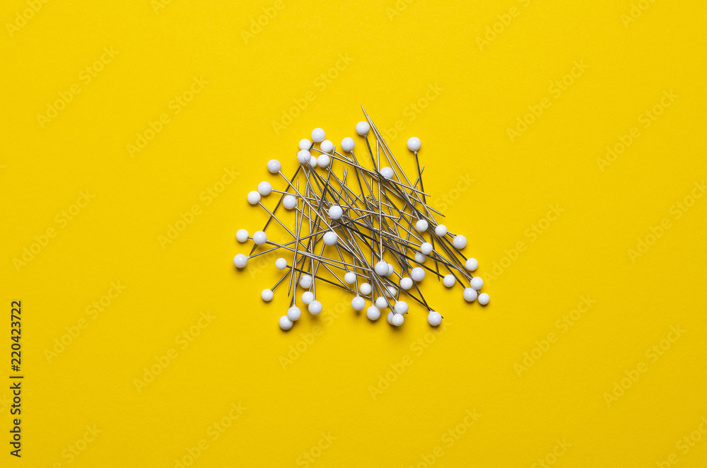 Fototapeta premium white ball pin on yellow background