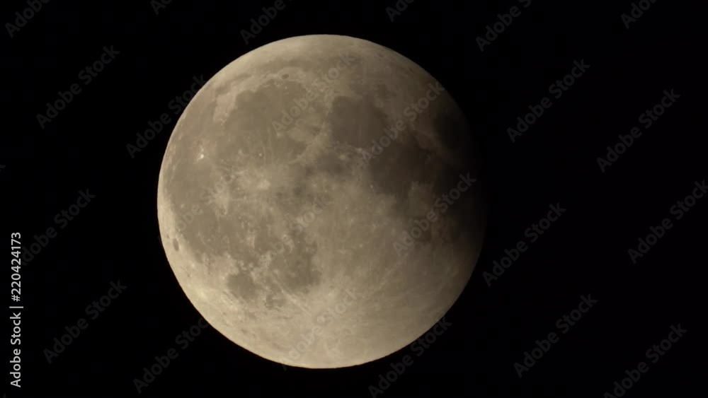 The moon becomes white again after full eclipse in Summer 2018. Shot from Madrid. The moon becomes white again after full eclipse in Summer 2018. Shot from Madrid.