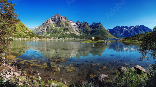 The landscape of Norway in the summer. View of Laupstadosen is a bay near Austvagoya Island  the northeasternmost of the larger islands in the Lofoten archipelago in Norway.