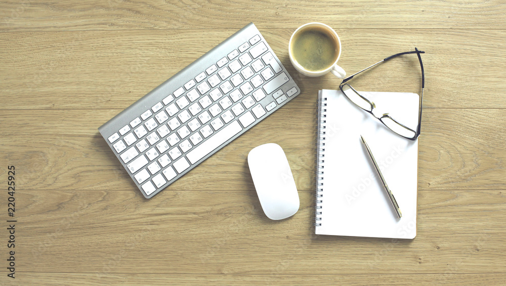 office desk table with computer keyboard, notebook with pen and coffee cup on desk office desk table with computer keyboard, notebook with pen and coffee cup on desk