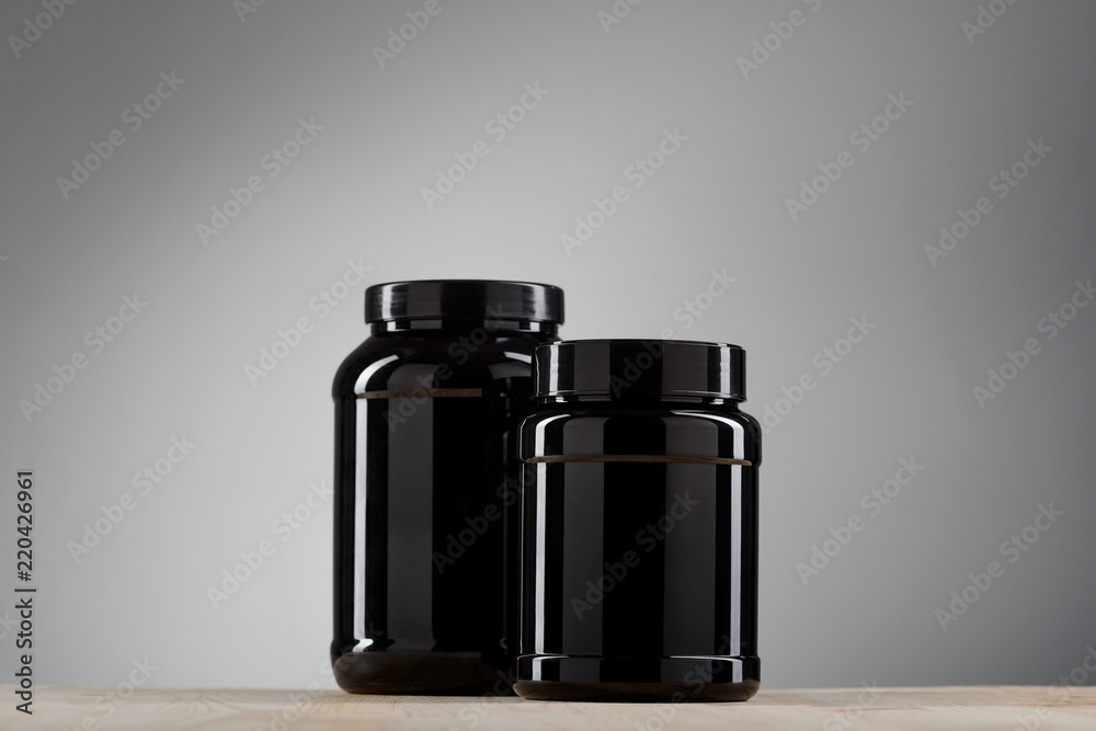 Two black cans with protein Two black cans with protein