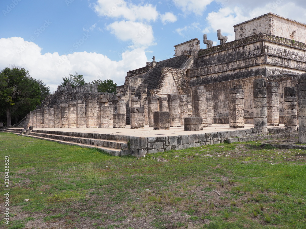 Scenic side of platform of Temple of Warriors building at Chichen Itza city in Mexico on February