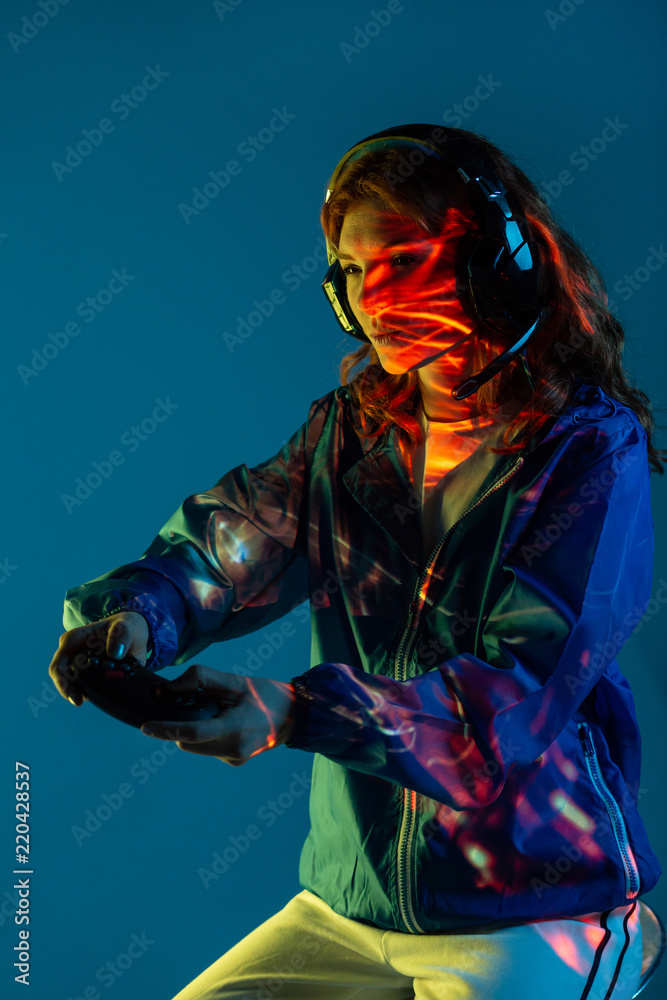 Woman enjoying with helmets and command video game Woman enjoying with helmets and command video game