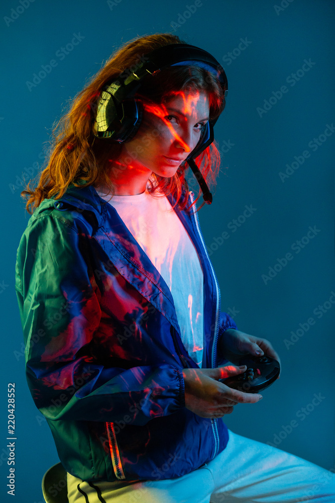 Woman enjoying with helmets and command video game Woman enjoying with helmets and command video game