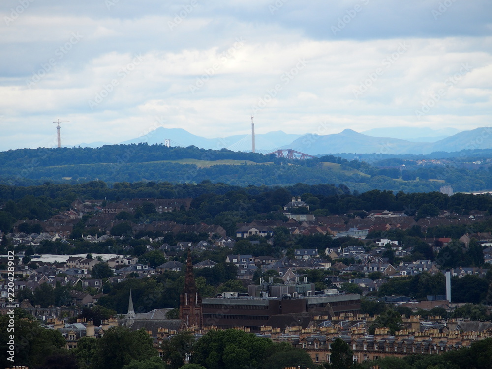 Scenic cityscape landscape of european Edinburgh city, Leith River and Forth Bridge in Scotland, UK at summer day