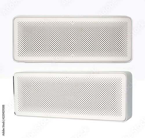 Wireless speaker isolated on white background. Front and side view.