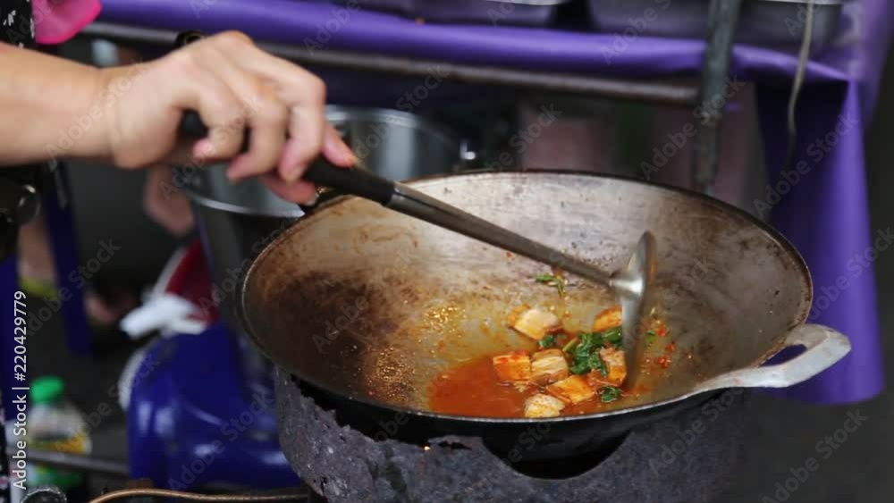 Thailand street food vendor cooking in a pan. Ready to serve. Thailand street food vendor cooking in a pan. Ready to serve.