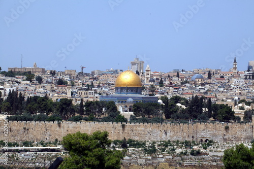 view of the old city of Jerusalem in Israel with an olive mountain. the golden dome of the Moslem mosque