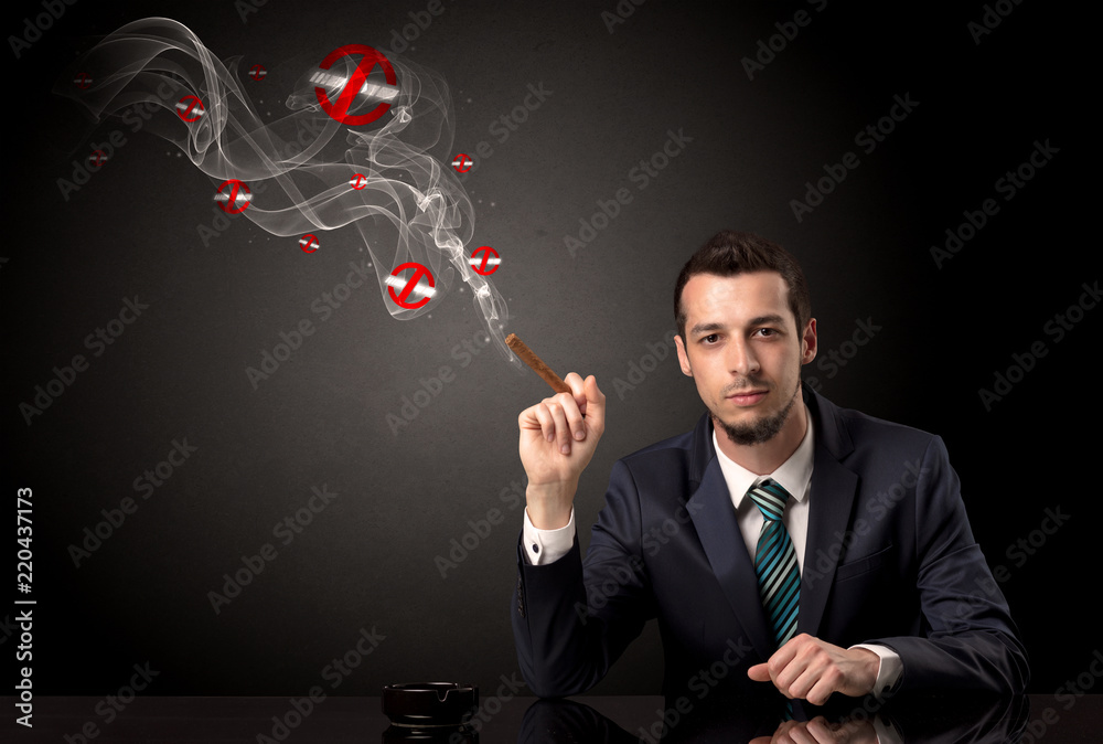 Businessman smoking with colored no smoking symbols nearby. Businessman smoking with colored no smoking symbols nearby.