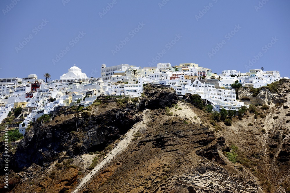 White houses clinging to the cliff tops