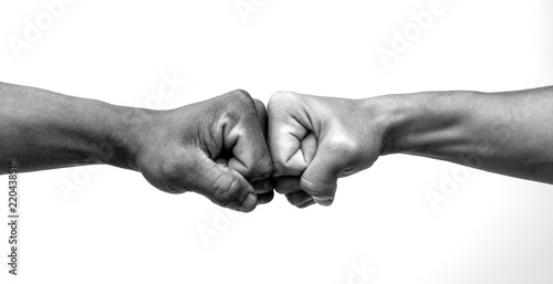 Man giving fist bump, monochrome, black and white image.