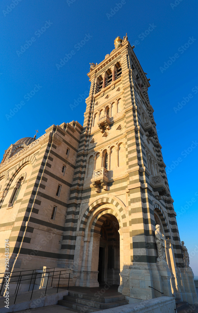 The scenic stone bell tower of Notre Dame de la Garde Basilica, Marseille, France. The scenic stone bell tower of Notre Dame de la Garde Basilica, Marseille, France.