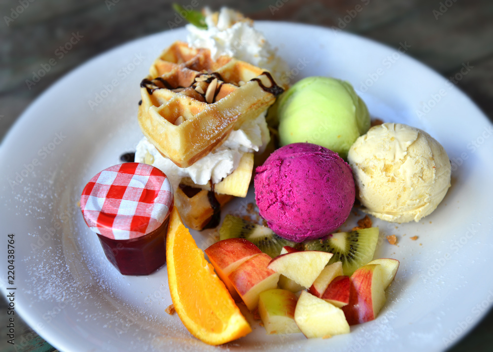 Ice cream mix fruit setting in white plate ready to eat. Ice cream mix fruit setting in white plate ready to eat.