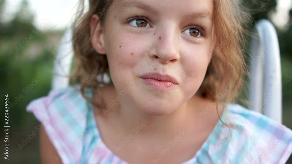 Lovely schoolgirl smiles in all her mouth. a beautiful girl, a close summer portrait. Healthy lifestyle, summer vacation, travel Lovely schoolgirl smiles in all her mouth. a beautiful girl, a close summer portrait. Healthy lifestyle, summer vacation, travel