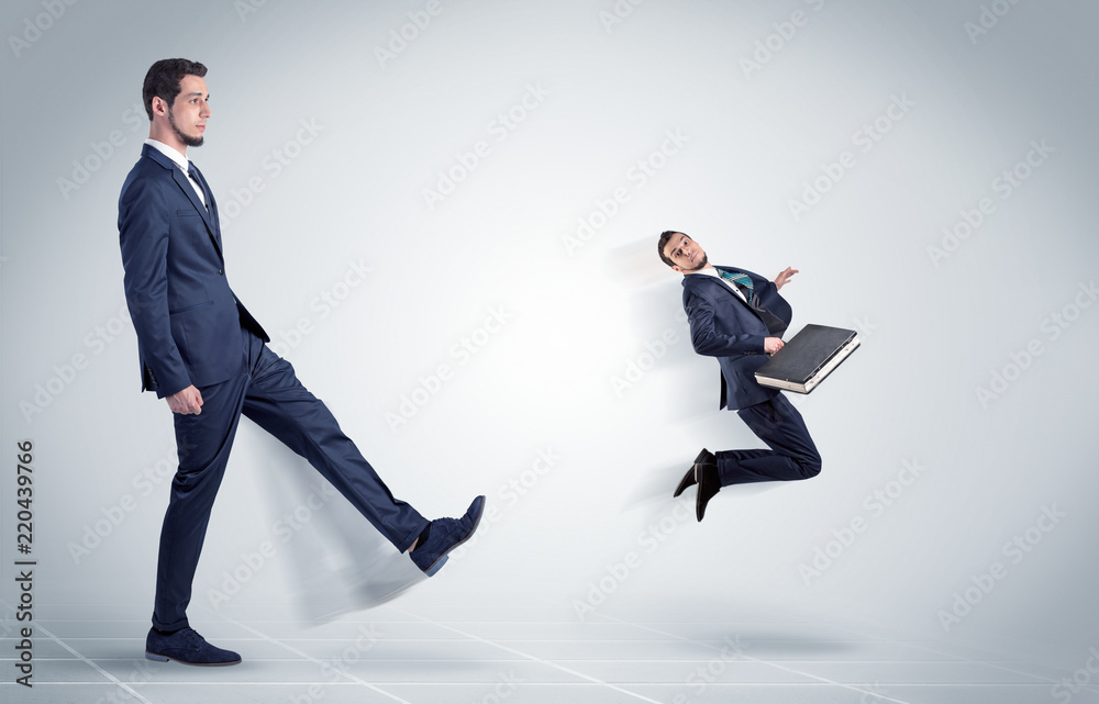 Young businessman fired cruel and aggressive by his boss with white background
Young businessman fired cruel and aggressive by his boss with white background