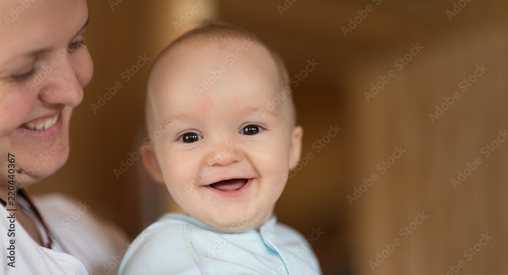 Portrait of a beautiful little baby with his mother. Close-up. copyspace Portrait of a beautiful little baby with his mother. Close-up. copyspace