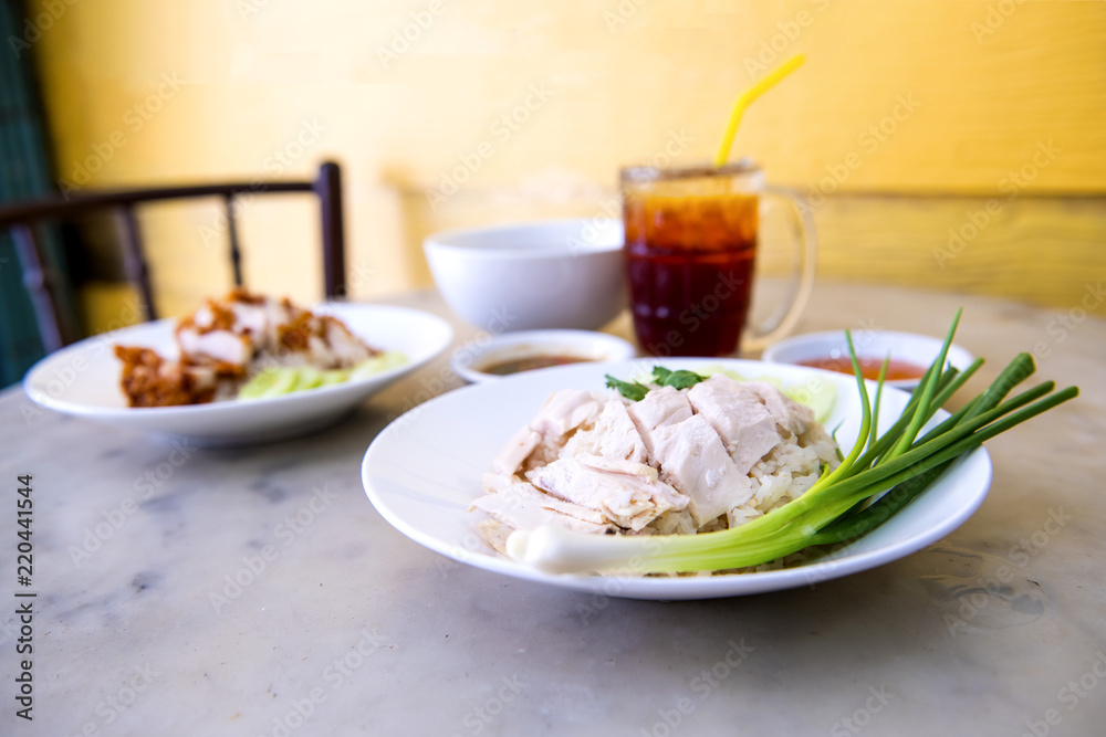 Boiled chicken, fillet on a plate with a slice of cucumber to eat a meal with rice and sauce, Fast Food commonly eaten in the countries of Thailand
