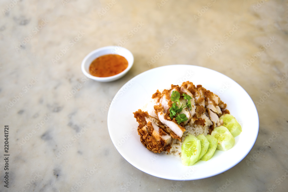 The fried chicken in a dish with cucumber,  eat with rice as foods that are beneficial to the body, Fast Food commonly eaten in the countries of Thailand