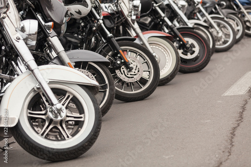 Row of motorcycles parked on a street © dechevm