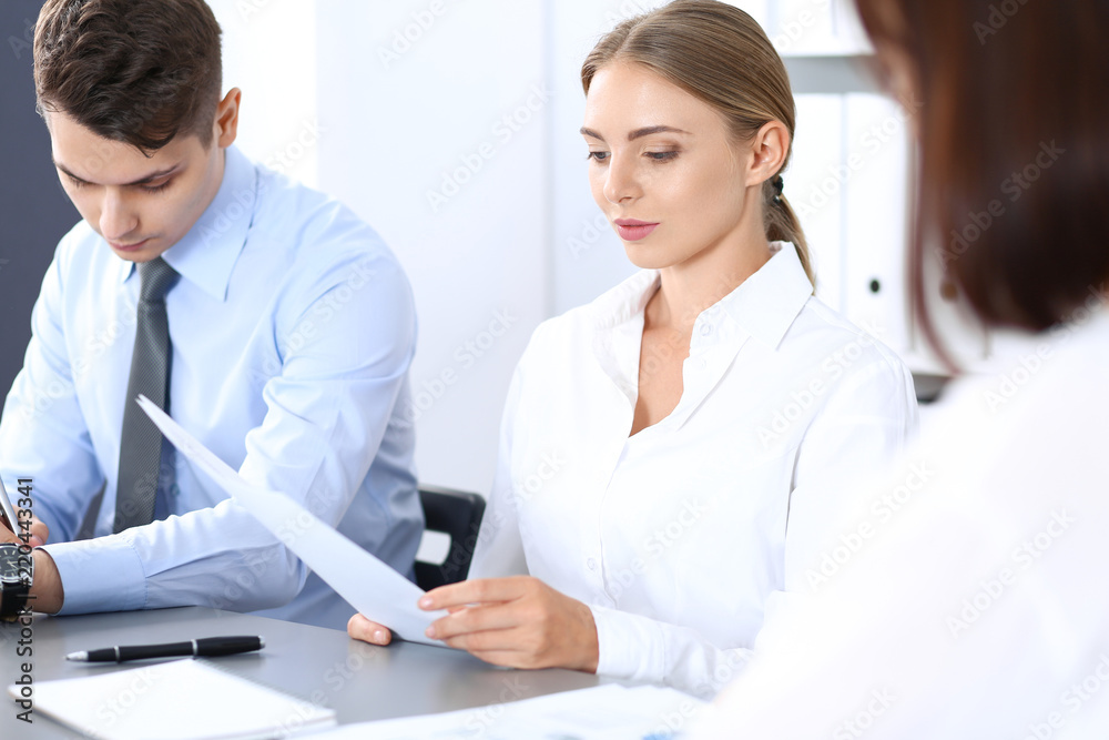 Group of business people or lawyers discussing terms of transaction in office. Meeting and teamwork concept Group of business people or lawyers discussing terms of transaction in office. Meeting and teamwork concept
