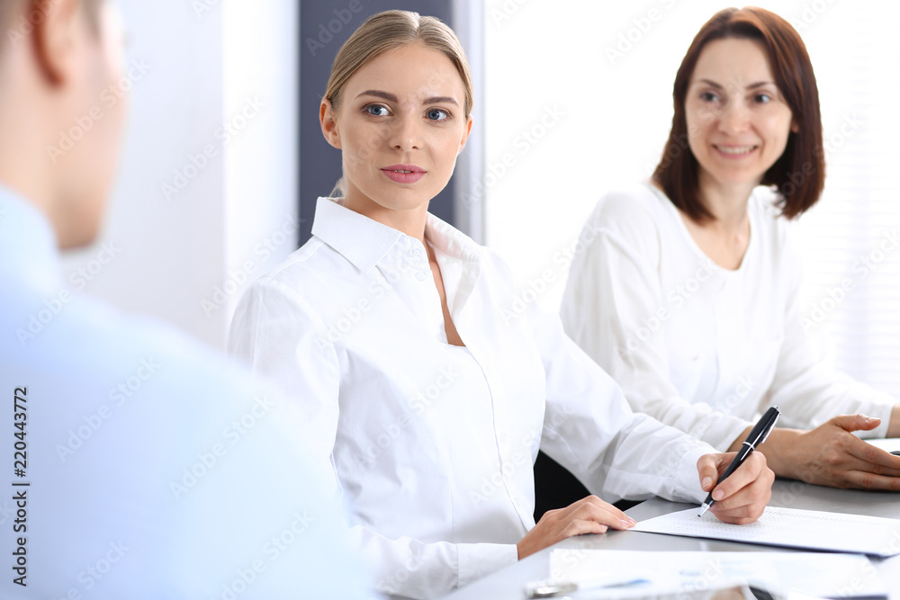 Group of business people or lawyers discussing terms of transaction in office. Meeting and teamwork concept Group of business people or lawyers discussing terms of transaction in office. Meeting and teamwork concept