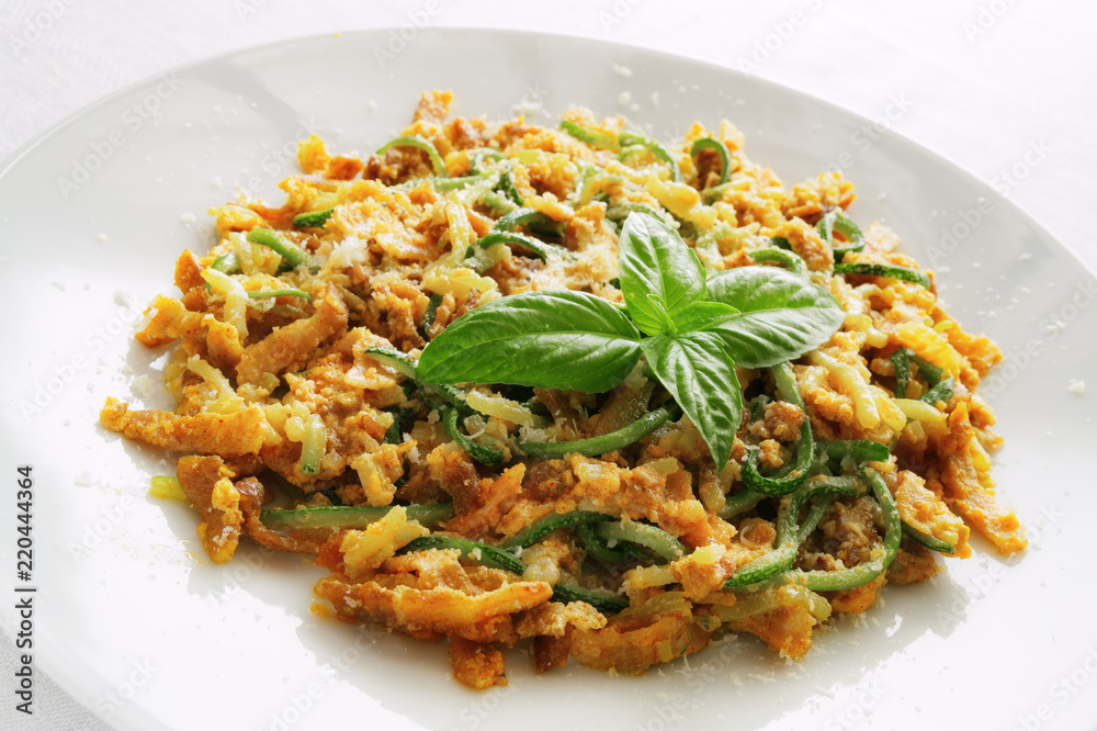 zucchini spaghetti carbonara decorated with basil leafs zucchini spaghetti carbonara decorated with basil leafs