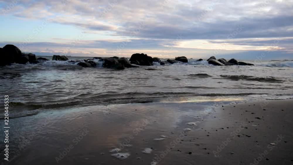 A scenic shot of rocks, water and beautiful light in Skagen A scenic shot of rocks, water and beautiful light in Skagen
