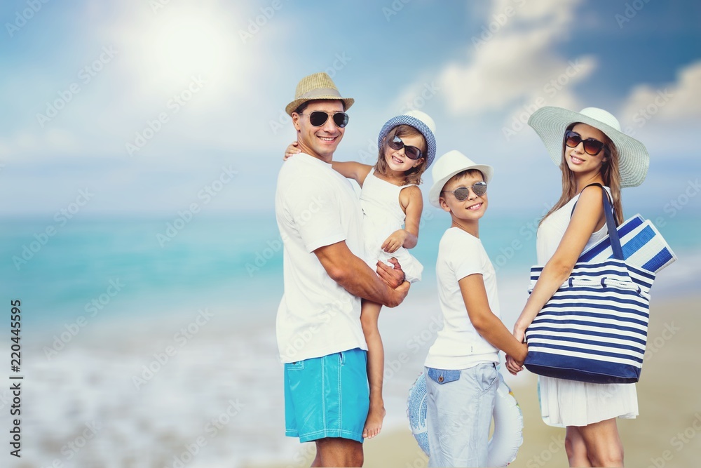 Happy Young Family have Fun Walking on Beach at Sunset Happy Young Family have Fun Walking on Beach at Sunset